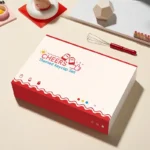 Playful Yakult artisan keycap set, nostalgic desk art, showcasing its whimsical bottle design and warm red beige tones from multiple perspectives.