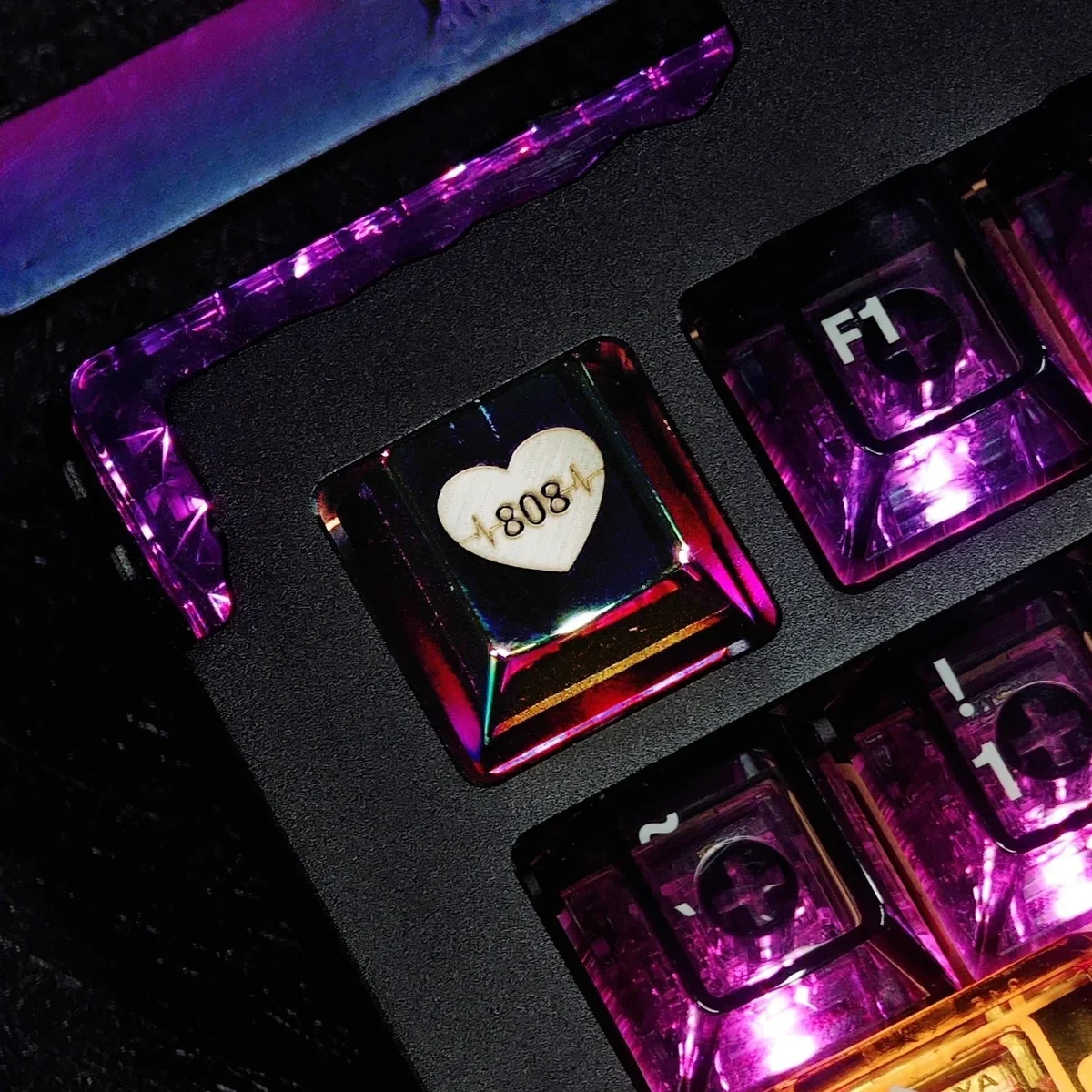 Vibrant 808 bass Heartbeat keycap. Rhythmic heartbeat and sound wave patterns displayed from multiple angles, highlighting its artistic metallic design.