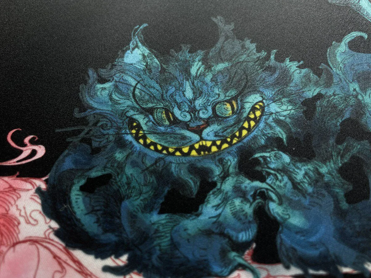 Close-up of the whimsical Alice in Wonderland Mouse Pad, revealing vibrant, enchanting illustrations and fantastical dreamscape design, ideal for creative design.