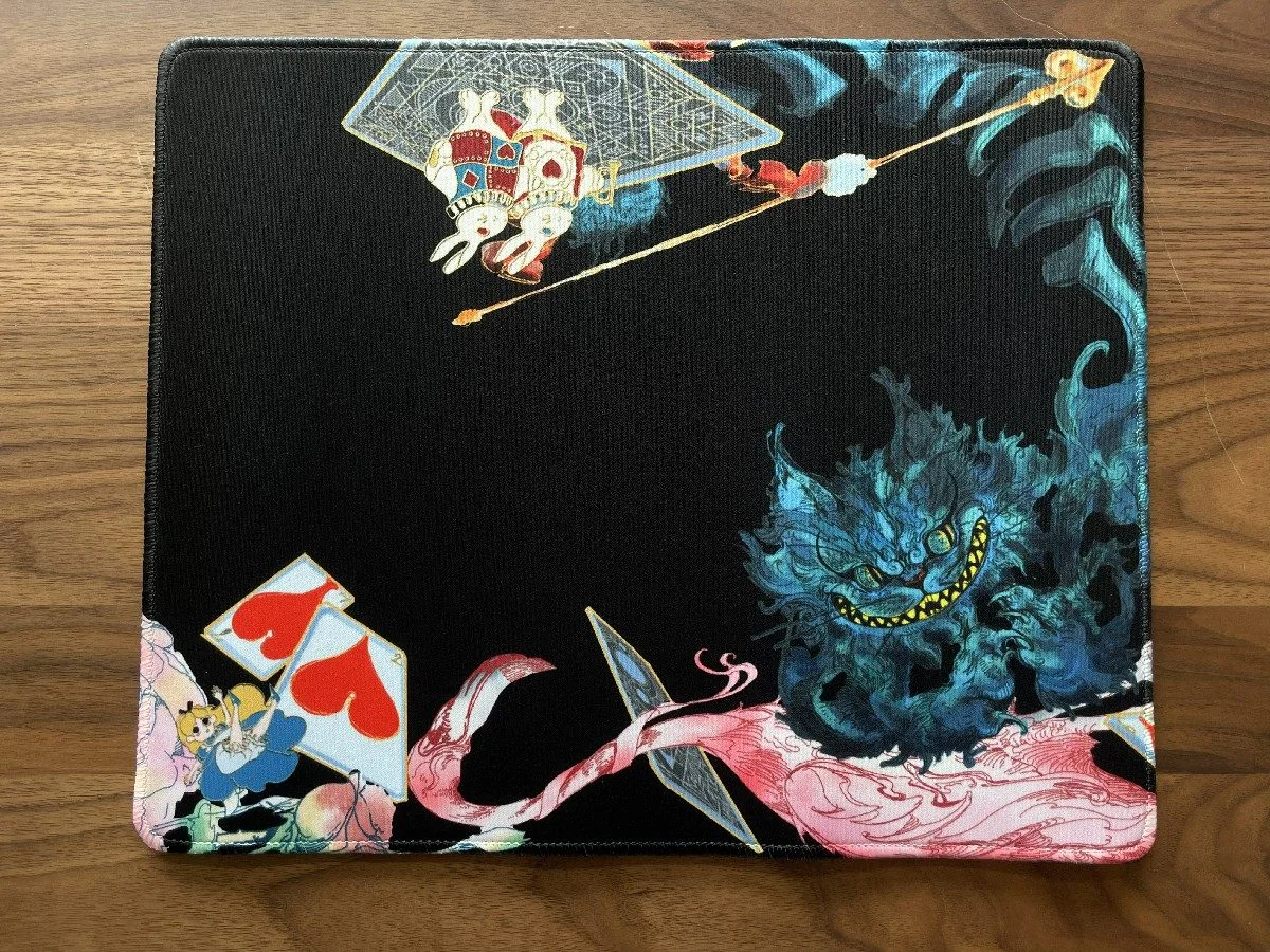 Whimsical Alice Wonderland Mouse Pad, a main display of its vibrant, enchanting illustrations from a fantastical dreamscape, perfect for creative space.