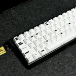 A playful Alteration PBT keycap set, showcasing its distinctive white-out design from multiple angles, perfect for nostalgic design.