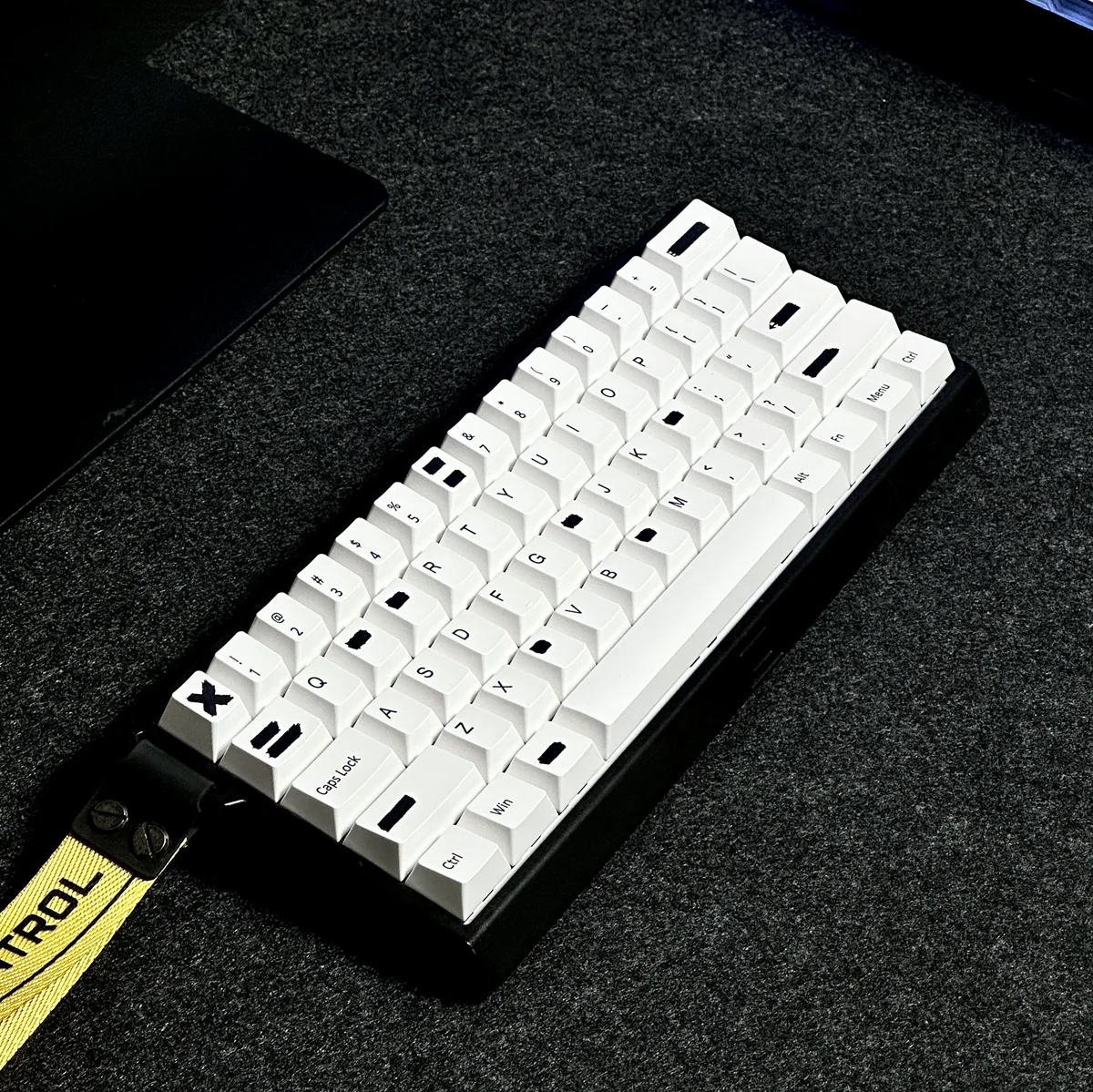 A quirky Alteration PBT Keycap Set, featuring its distinctive white-out design and durable PBT material, perfect for nostalgic desks.