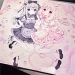 Amairo Chocolate Gaming Mouse Pad, a sweet desk treat, shown from various angles. Whimsical design, rich characters tones, sweet motifs.