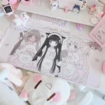 Whimsical angelic maid extra-large desk mat, showcasing its pastel pink and white kawaii aesthetic and sweet dessert motifs from a unique angle.