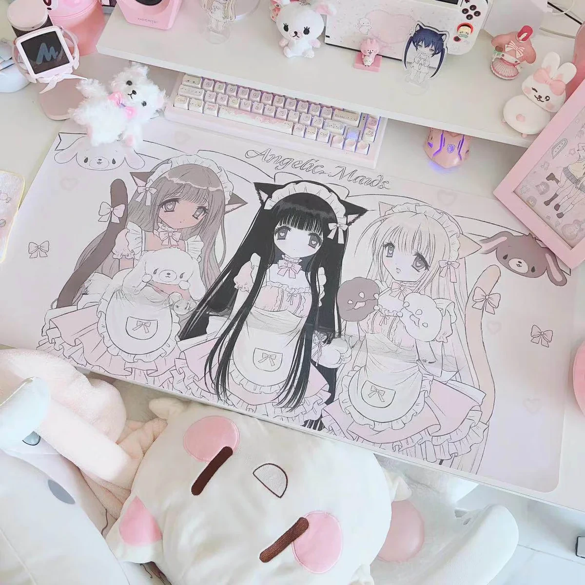 Whimsical angelic maid extra-large desk mat, showcasing its pastel pink and white kawaii aesthetic and sweet dessert motifs from a unique angle.