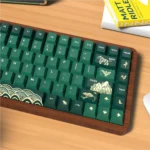 A close-up view of the premium PBT Dye-Sub Animal Crossing keycap set, showcasing charming-themed designs in deep greens and earthy tones.