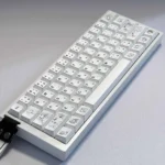 Aesthetic display of an original minimalist anime PBT keycap set for custom mechanical keyboards, featuring subtle, clean graphics and a soft color palletes.