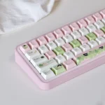 Whimsical Apple Cat keycaps set crafted from durable PBT dye-sub, displayed from multiple angles to highlight charming illustrations and soft design.