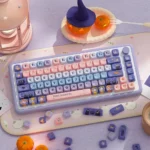 Enchanting PBT Dye-Sub Apprentice Witch Keycaps set, showcasing whimsical pastel hues and arcane symbols for custom keyboards.