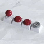 Premium aluminum arcade joystick & Button keycaps, showcasing their intricate miniature design and sleek metallic finish from various angles in a playful design.