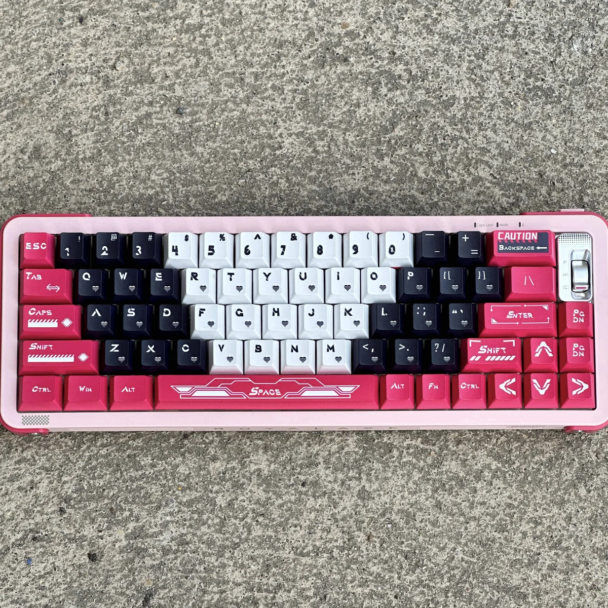 Iconic Arcee PBT keycap set. Vibrant pink, purple, white keycaps with durable PBT dye-sub legends, evoking futuristic Transformers nostalgia.