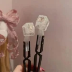 Close-up of Window Butterfly Artisan Keycap, showcasing the intricate butterfly and serene window diorama within delicate resin.