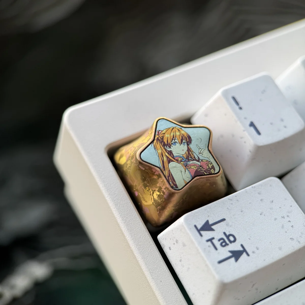 Premium Asuka Langley Soryu titanium keycap, showcasing its fiery style, polished finish, and star pentagon design from various angles.