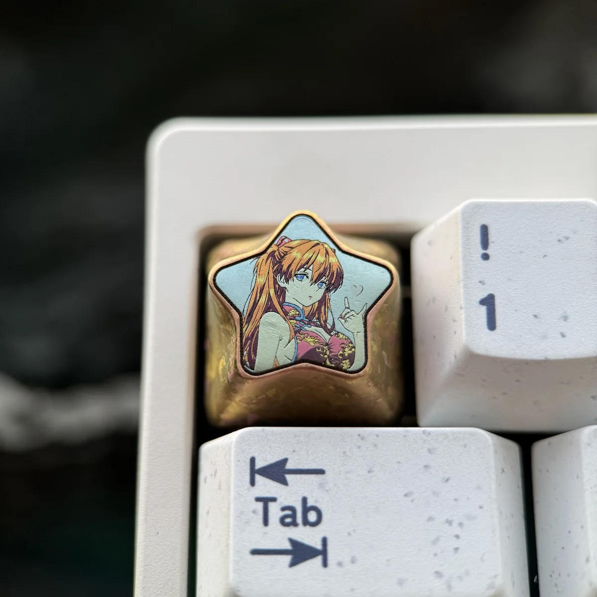 Premium Asuka Langley Soryu titanium keycap, featuring fiery colors, a striking star pentagon, and a polished finish, ideal for anime collectors.