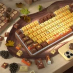 Autumn Serenity PBT Dye-Sub Keycap Set gallery, showing durable PBT and warm autumn leaf designs from multiple angles for a tranquil, artistic keyboard.