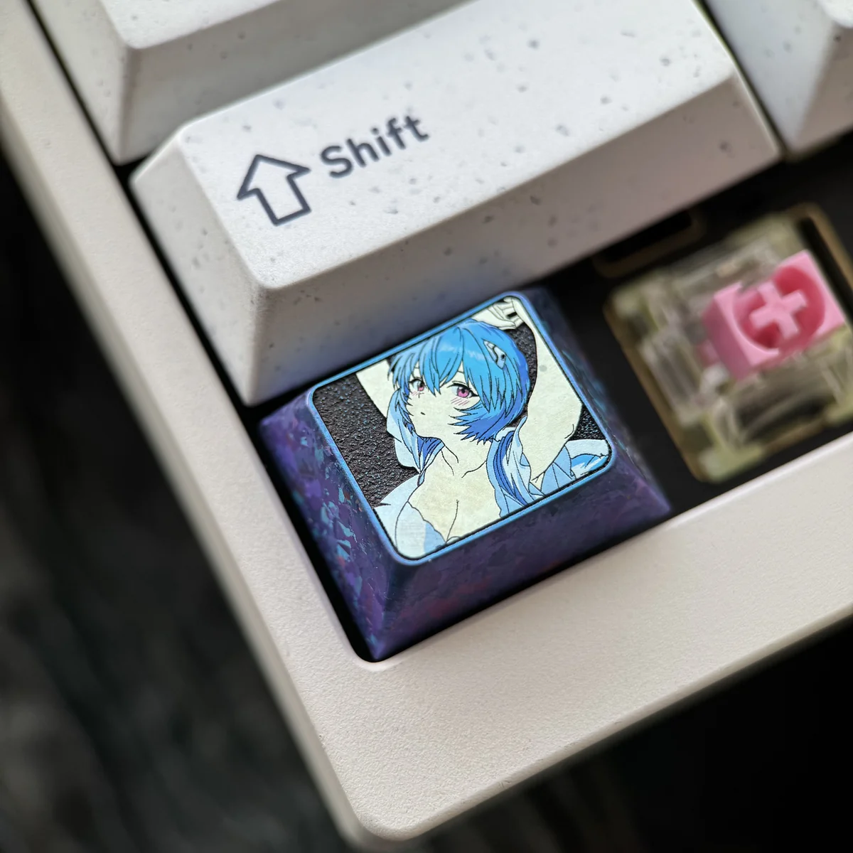 Detailed gallery views of the premium Iconic Ayanami Rei Titanium Alloy Keycap, highlighting its sleek metallic finish and intricate Evangelion design.