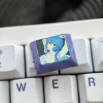 A close-up view of the premium Ayanami Rei Titanium Keycap, showcasing its sleek metallic finish and intricate Evangelion anime design from a side angles.