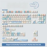 This boxed 158-key Vibrant PBT Dye-Sub Beach Summer keycap set, in Cherry profile, showcases playful blues and sandy for sunny be