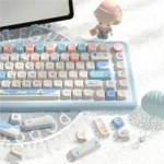 Artistic display of Beach Summer Keycaps Set. Durable PBT and SCA profile shine with vivid blues, warm sands, and tropical details, evoking a serene beach design.