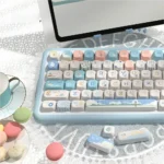 Vibrant Beach Summer PBT SCA Profile Keycaps Set displayed from various angles. Durable PBT material highlights ocean blues and warm sands, evoking a tranquil setup.
