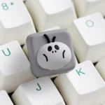 Gallery showcasing the whimsical Big-Head cockroach artisan keycap from various angles, highlighting its unique, expressive design crafted for joy.
