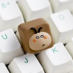 Whimsical big-head cockroach artisan keycap, captured from a playful side angle, emphasizing its unique, expressive design. A stress-relieving, handcrafted design.