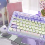 Vibrant PBT MDA birthday keycaps set, playfully adorned with cakes, balloons, and gifts, showcased from multiple angles.