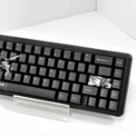 Unique Black Blade Dye-sub PBT keycaps set for mechanical keyboards, displaying intricate dark designs and sharp, mysterious aesthetics from a sleek angles.