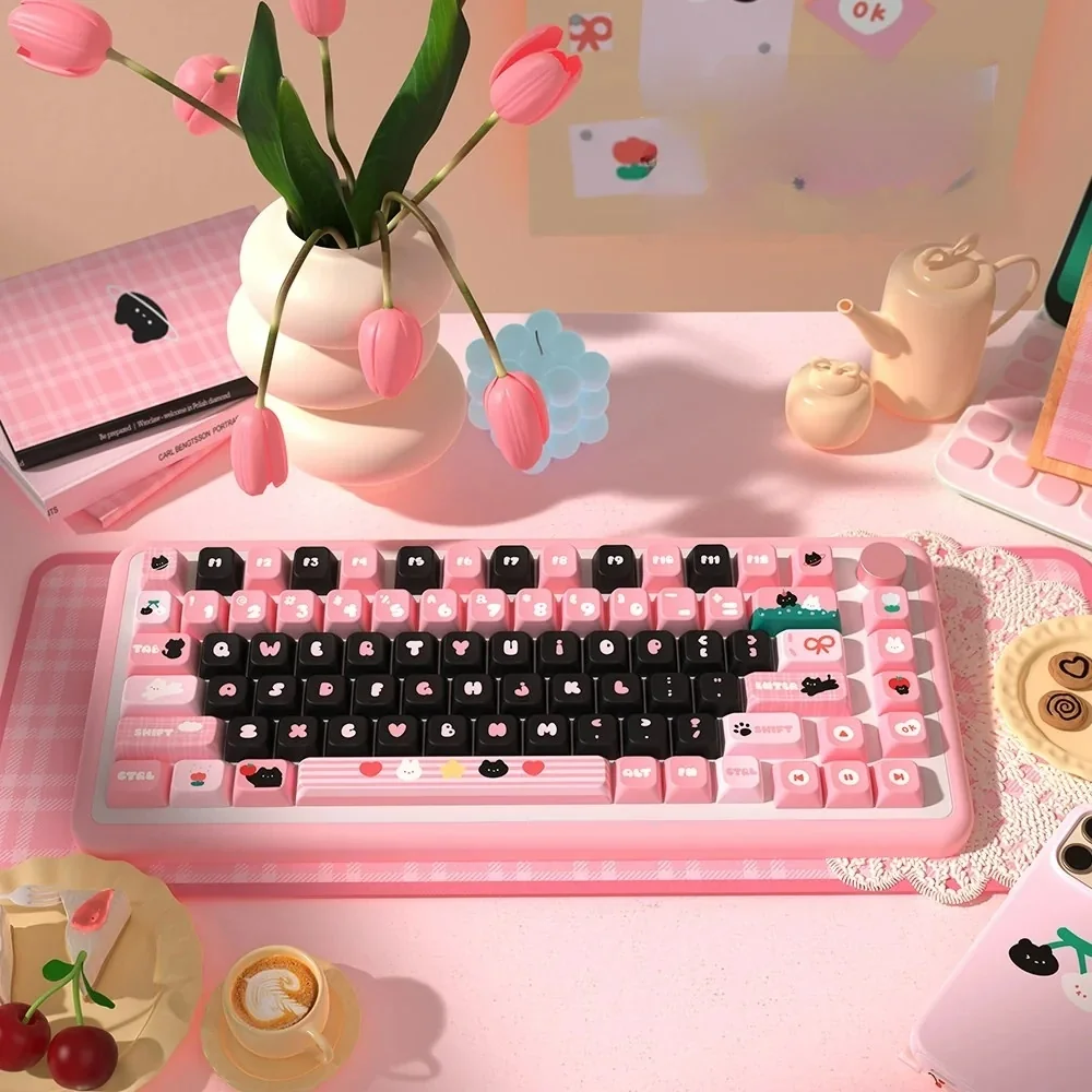 Adorable PBT dye-sub black cat keycaps set displayed on a clean surface, highlighting the whimsical motif and playful artistic style.
