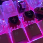 Close-up of a charming, handcrafted Blackberry Cookie Artisan Keycap, showcasing its exquisite texture and intricate details from a unique angle.