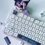 Playful blue pixel PBT dye-sub keycaps set for mechanical keyboards, showcasing their bold retro digital design and durable legends from a detailed angles.