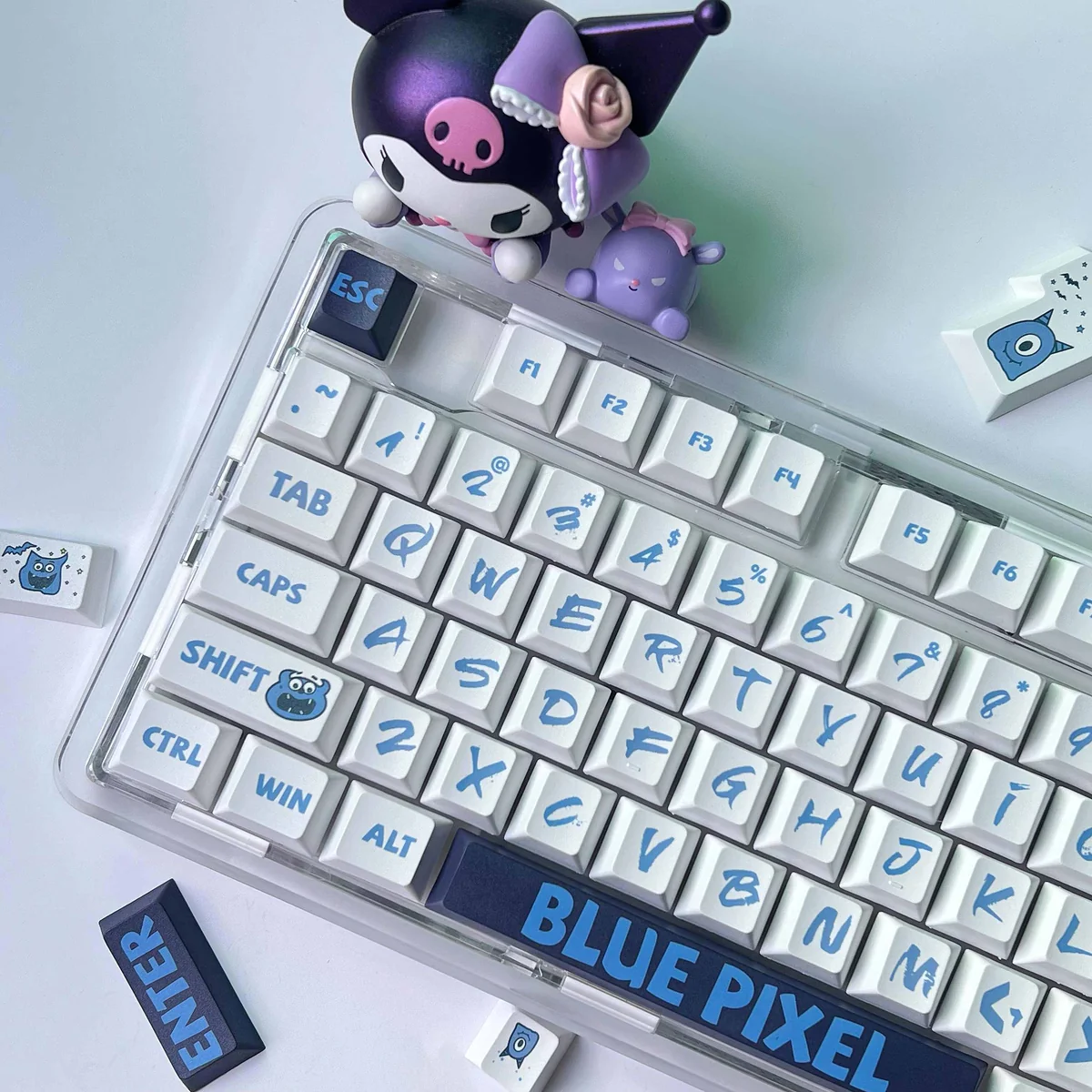 Playful blue pixel PBT dye-sub keycaps set for mechanical keyboards, showcasing their bold retro digital design and durable legends from a detailed angles.