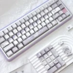 Broken Window Butterfly Cherry Keycap Set featuring artistic butterfly designs breaking free. Vibrant side-lit legends illuminate each key, creating a captivating setup.