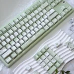 Broken Window Butterfly Cherry Keycap Set, showcasing the artistic butterfly designs breaking free, illuminated by vibrant side-lit legends from multiple angles.