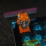 Premium Bumblebee artisan keycap, iconic Transformers design in yellow/black. Translucent for RGB backlighting, highlighting its heroic aesthetic.