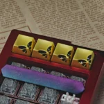 Exquisite butterfly keycap, showcasing its delicate metallic form and intricate nature-inspired design for an artisanal keyboard upgrade.