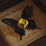 Exquisite butterfly keycap, featuring delicate metallic form and intricate design from multiple angles, an artisanal upgrade.