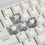 Whimsical pink butterfly keycaps, an artisan WASD set showcasing high-transparency 3D butterflies and delicate hearts for a dreamy keyboard.