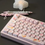 Cardcaptor Sakura PBT MOA keycap set, a magical anime aesthetic featuring pastel colors, stars, and iconic motifs, captured from a unique perspective view.
