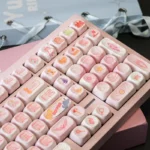 Close-up of Cardcaptor Sakura PBT MOA keycaps set, highlighting magical anime aesthetic with pastel colors, stars, and Sakura motifs from a unique angles.