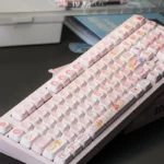 Close-up view of the Cardcaptor Sakura PBT MOA keycaps set, highlighting their delicate pastel colors, sparkling star designs.
