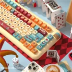 Whimsical Cat Circus PBT Dye-Sub Keycaps Set, showcasing vibrant, playful cat illustrations from various angles. Artistic and high-quality keycaps.