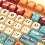 Whimsical Cat Circus PBT Dye-Sub Keycaps Set feature vibrant, playful cat art. Bright, joyful colors show artistic detail.