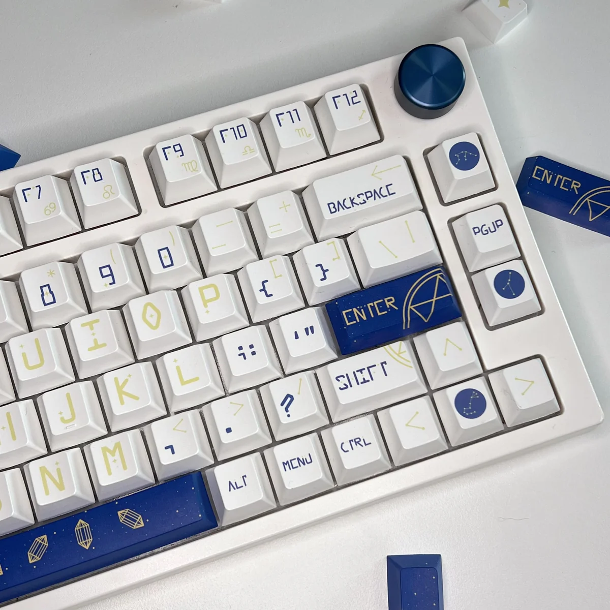 Celestial Constellation PBT keycaps set displayed from multiple angles, revealing durable quality, vibrant starry night motifs, and intricate astrological design.