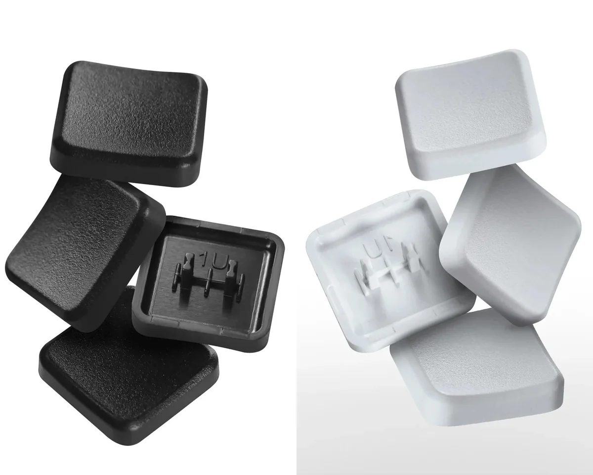 Sleek, minimalist CFX PLUS Kailh Choc V1 keycaps in black and white, highlighting their durable PBT construction and low-profile design.