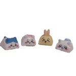 A collection of whimsical handmade resin Chiikawa artisan keycaps from various angles, showcasing their unique, meticulously sculpted designs.