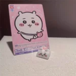 Explore the whimsical charm of a handmade Chiikawa artisan keycap, featuring its unique resin sculpting and playful character from all delightful angles.