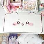 Adorable Chiikawa & Usagi leather desk mat showcasing its charming kawaii character art from a top-down view on a desk.
