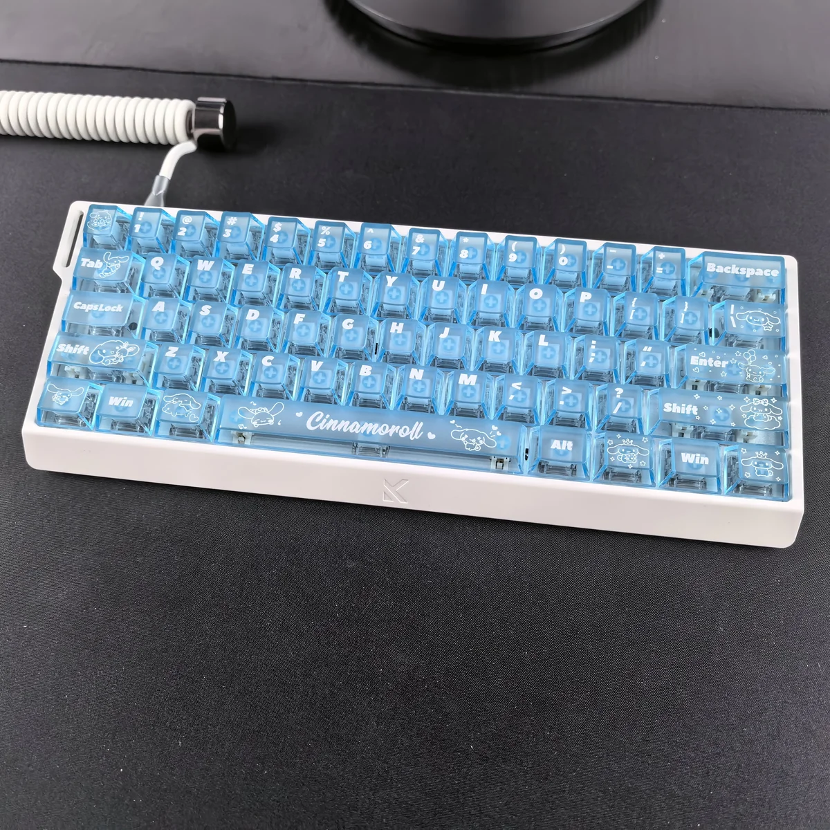 Dreamy Cinnamoroll translucent PC keycaps set, presented from various angles, capture the adorable design and captivating blue mist backlighting.