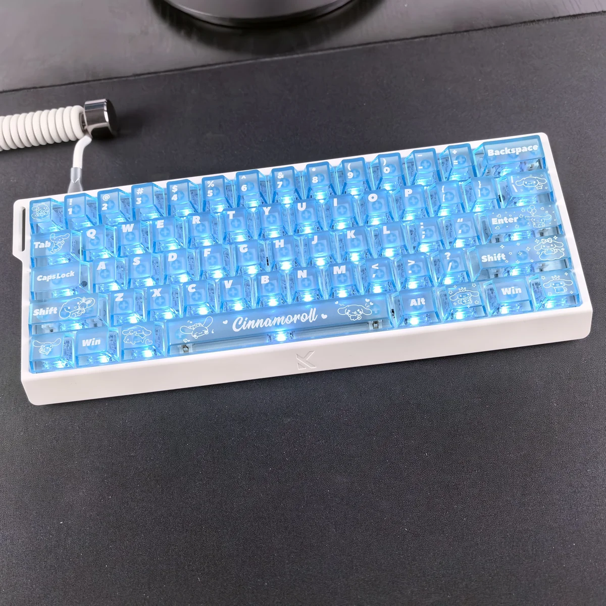 Close-up of adorable Cinnamoroll translucent PC keycaps set in a dreamy blue mist, showcasing their captivating backlighting across various angles.